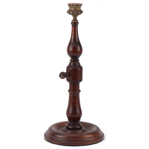 317 - Victorian mahogany and brass rise and fall candlestick with brass sconce, 31cm when closed