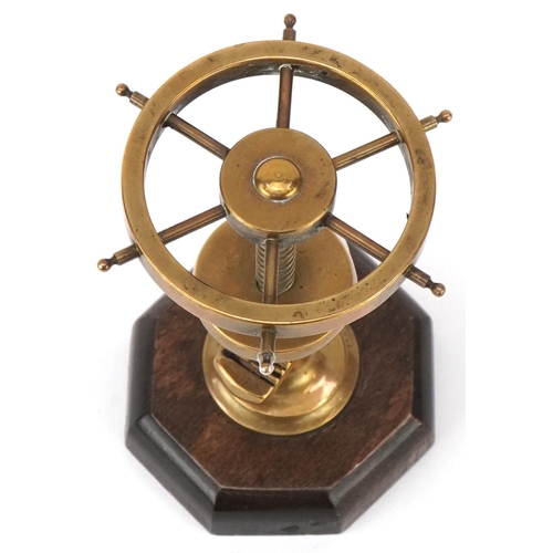 33 - Vintage wooden and brass nutcracker in the form of a ship's wheel, 12cm high