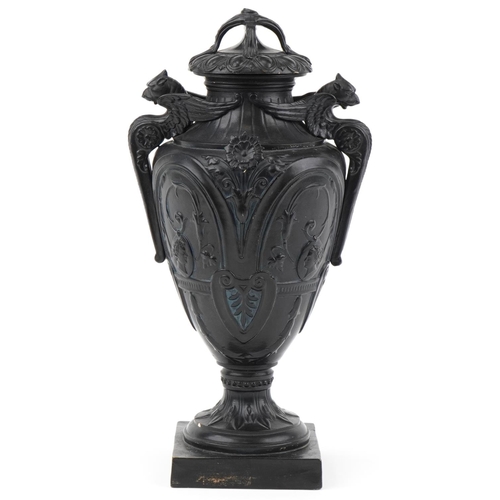 131 - Victorian black painted pottery urn and cover decorated with medallions and swags, WSS and numbered ... 