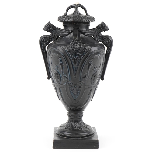 131 - Victorian black painted pottery urn and cover decorated with medallions and swags, WSS and numbered ... 