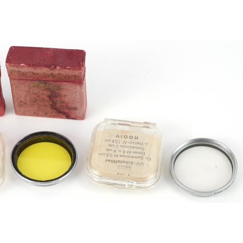 767 - Various Leica Leitz Wetzlar camera lenses and boxes, the largest 4.5cm in diameter