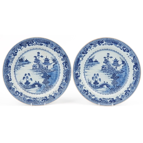 4 - Large pair of 18th century Chinese blue and white porcelain chargers hand painted in the willow patt... 