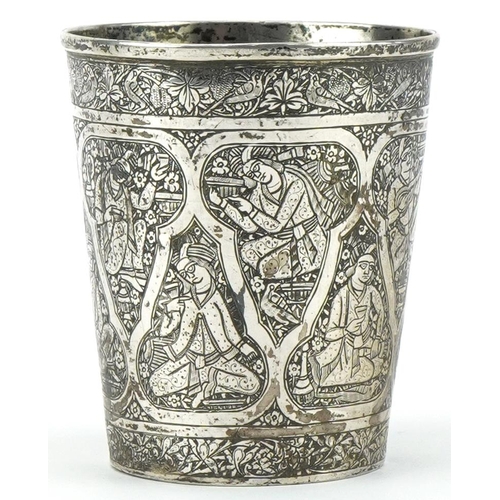 379 - Islamic silver beaker profusely engraved with figures, impressed marks to the base,  8cm high, 84.2g