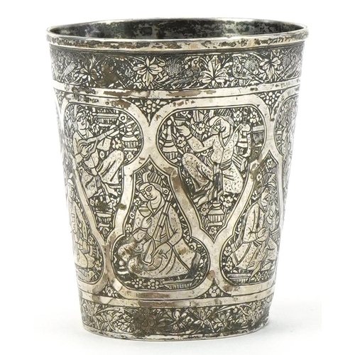 379 - Islamic silver beaker profusely engraved with figures, impressed marks to the base,  8cm high, 84.2g