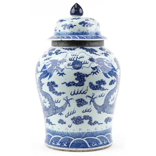 Large Chinese Kangxi jar and cover hand painted with a dragon chasing the flaming a pearl, 66cm high