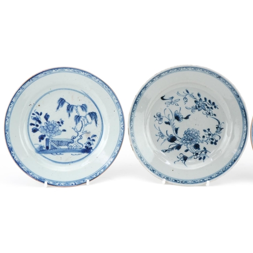 7 - Three 18th century hand painted blue and white plates, two in the Willow pattern, one with flowers, ... 