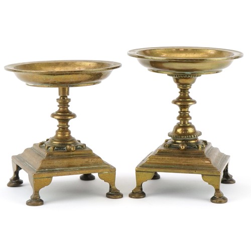 299 - Two bronze pedestal tazzas with turtle decoration, mounted on hoof feet, the largest 15cm high