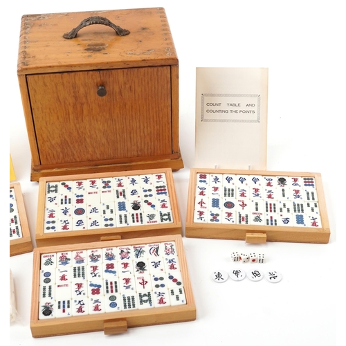 1529 - H P G & S Ltd Chinese mahjong set by Jackpot with instructions, housed in a light oak five drawer ch... 