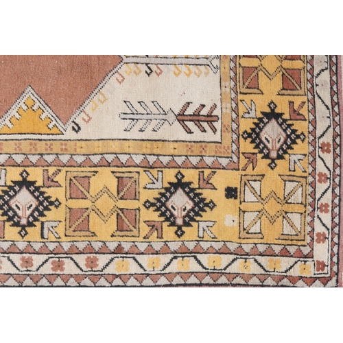 1124 - Large Middle Eastern brown and cream ground prayer rug with geometric borders, 225cm x 112cm