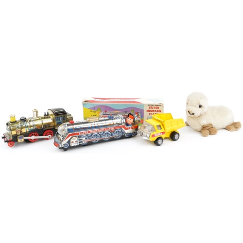 1567 - Battery operated tinplate Silver Mountain Flash train, a similar train, Yellow Tonka dumper and a Me... 