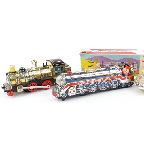 1567 - Battery operated tinplate Silver Mountain Flash train, a similar train, Yellow Tonka dumper and a Me... 