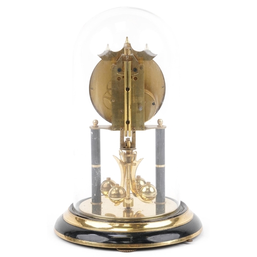 418 - Brass anniversary clock under a glass dome with rose design dial, 32cm high