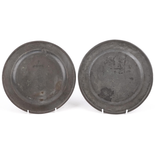 302 - Pair of 18th century pewter plates, stamped Edward Ubly London marks, each 23cm in diameter