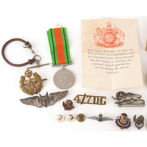 1738 - Assorted military interest cap badges including Argyll & Sutherland, military watch chain, patches a... 