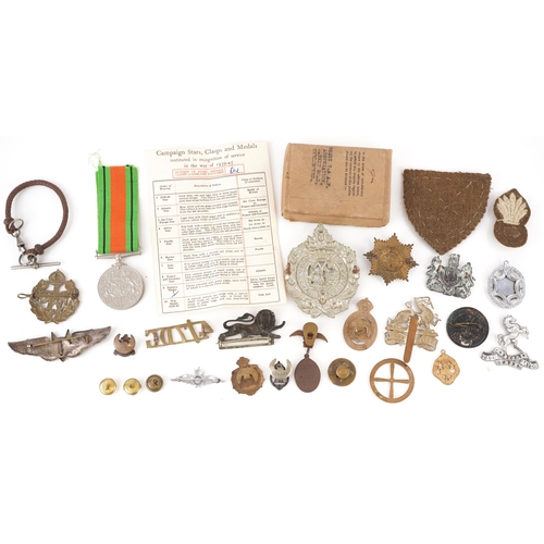 1738 - Assorted military interest cap badges including Argyll & Sutherland, military watch chain, patches a... 