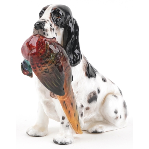 1175 - Royal Doulton seated Cocker Spaniel with Pheasant, HN1137, 17cm in length