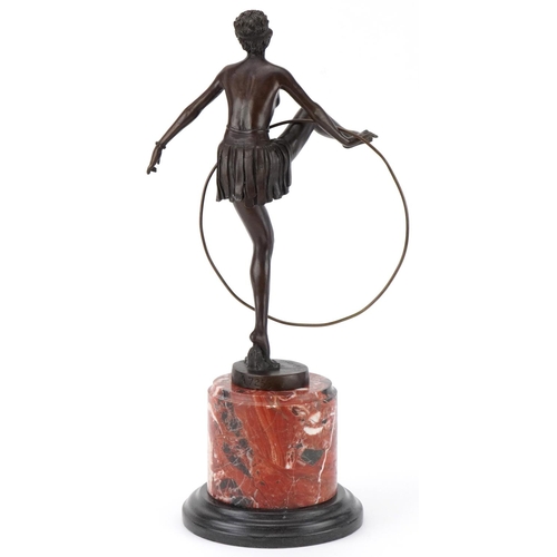 235 - After D'Alonzo, patinated bronze statuette of a semi nude Art Deco female dancer raised on a cylindr... 