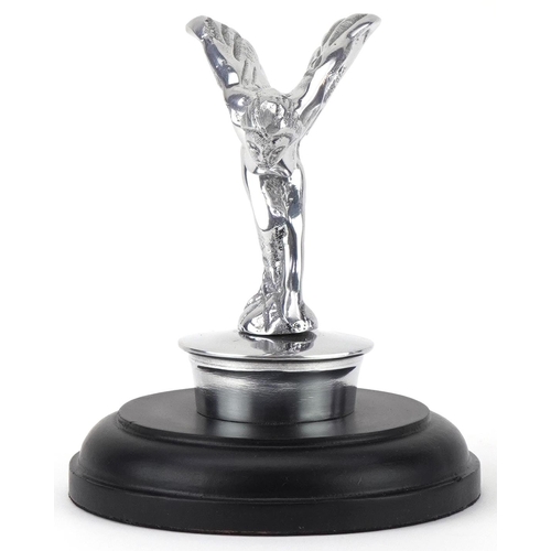 1352 - Automobilia interest silvered metal Spirit of Ecstasy raised on a circular ebonised base, 14.5cm hig... 