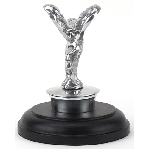 1352 - Automobilia interest silvered metal Spirit of Ecstasy raised on a circular ebonised base, 14.5cm hig... 