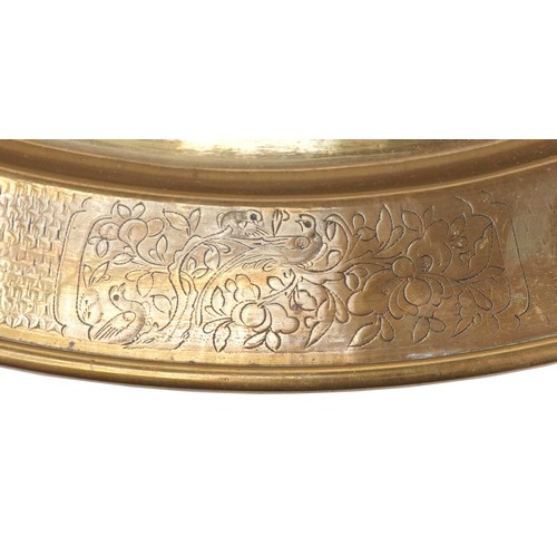 187 - Chinese bronze charger finely engraved with panels of flowers, wild animals and calligraphy, 57cm in... 