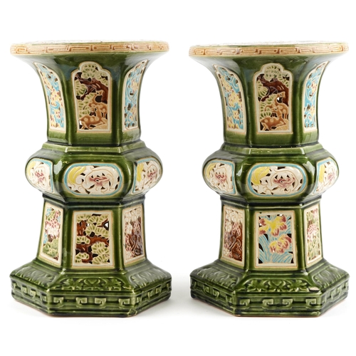 1368 - Pair of Chinese pierced porcelain archaic style garden seats each hand painted with flowers having s... 