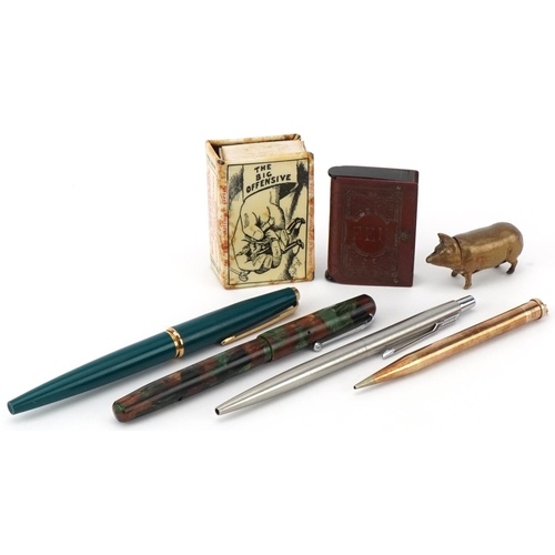473 - Fountain pens, brass pig vesta, vulcanite vesta, cigarette case, and a matchbox holder for The Great... 
