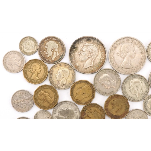 619 - Assorted silver and later coinage including sixpences and threepenny pieces, George V and later