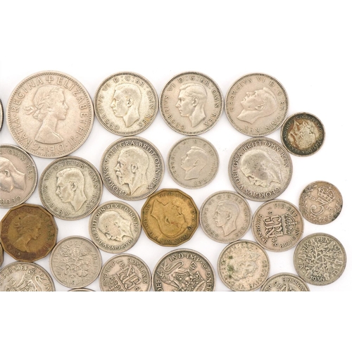 619 - Assorted silver and later coinage including sixpences and threepenny pieces, George V and later