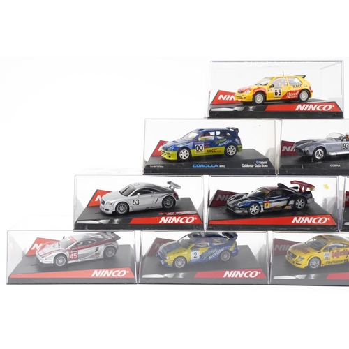 1593 - Ten Ninco 1:32 scale model slot cars with cases including Citroen Saxo, LTDTTABT and Mini