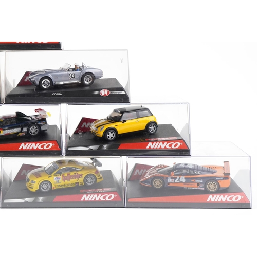 1593 - Ten Ninco 1:32 scale model slot cars with cases including Citroen Saxo, LTDTTABT and Mini