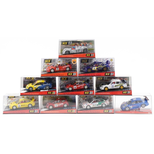 1595 - Ten Matchbox SCX 1:32 scale model slot cars with cases including Citroen C2, Mitsubishi Lancer and S... 