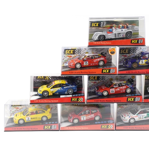 1595 - Ten Matchbox SCX 1:32 scale model slot cars with cases including Citroen C2, Mitsubishi Lancer and S... 