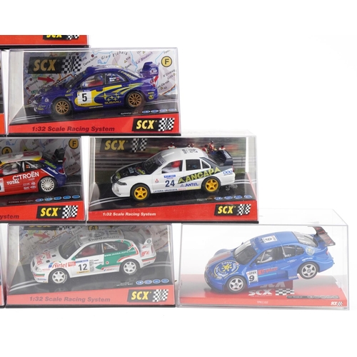 1595 - Ten Matchbox SCX 1:32 scale model slot cars with cases including Citroen C2, Mitsubishi Lancer and S... 