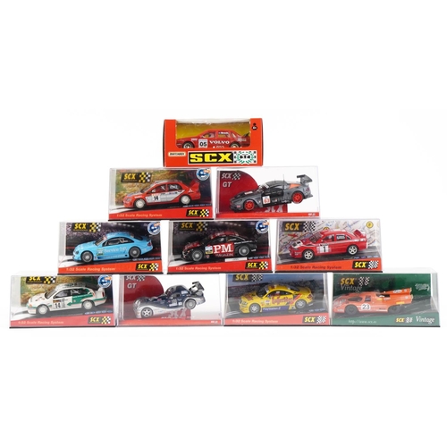 1596 - Ten Matchbox SCX 1:32 scale model slot cars with cases including Skoda Octavia WRC, Opel Astra V8 Co... 