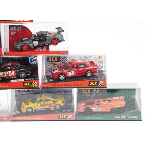 1596 - Ten Matchbox SCX 1:32 scale model slot cars with cases including Skoda Octavia WRC, Opel Astra V8 Co... 