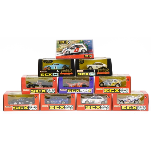 1594 - Ten Matchbox SCX 1:32 scale model slot cars with boxes and cases including Subaru Impreza, Porsche 9... 