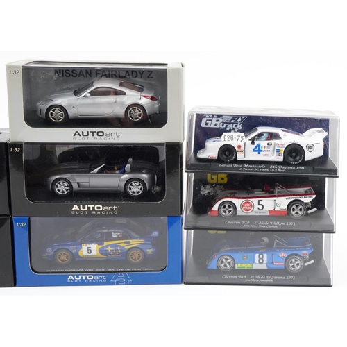 1601 - Eight 1:32 scale model slot cars with boxes and cases including Fly Lancia Beta, Autoart Mazda RX8 a... 