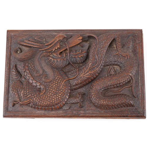 200 - Two oriental hardwood boxes carved with dragons, the largest 7cm H x 28cm W x 17cm D