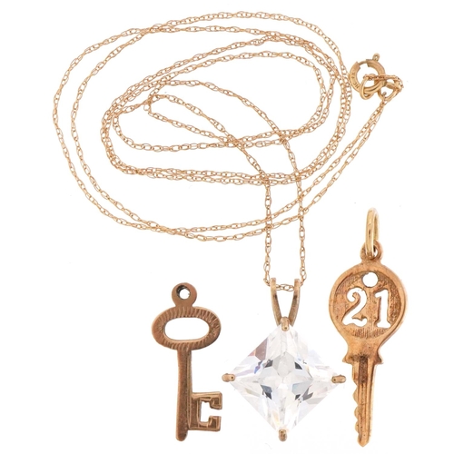 2229 - 9ct gold jewellery comprising cubic zirconia pendant on necklace and two charms in the form of keys,... 