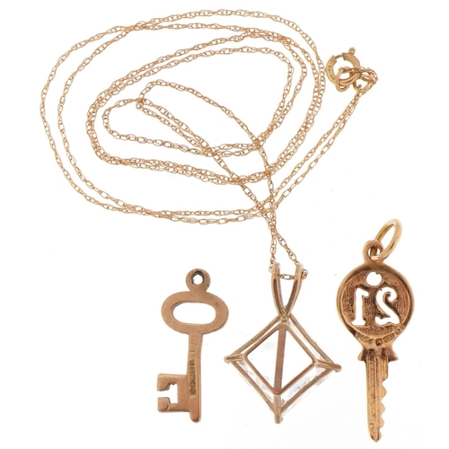 2229 - 9ct gold jewellery comprising cubic zirconia pendant on necklace and two charms in the form of keys,... 