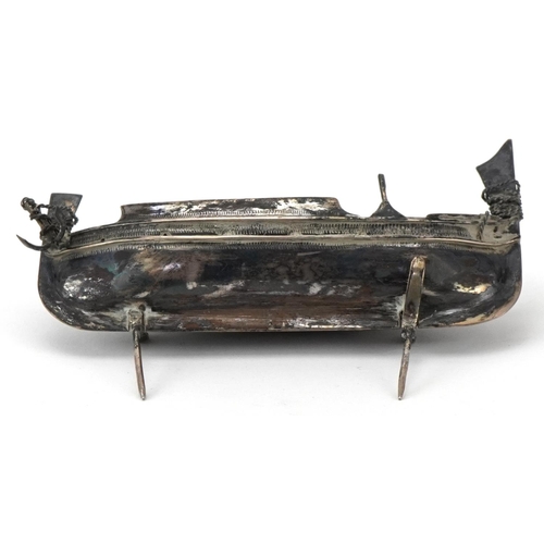 514 - Maltese unmarked silver model of a fishing boat raised on an ebonised wood stand, overall 14cm in le... 