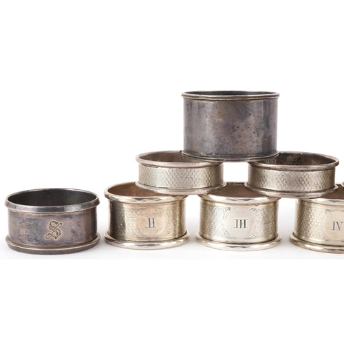 504 - Ten Victorian and later silver napkin rings, some with engine turned decoration, the largest 5cm in ... 