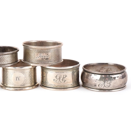 504 - Ten Victorian and later silver napkin rings, some with engine turned decoration, the largest 5cm in ... 