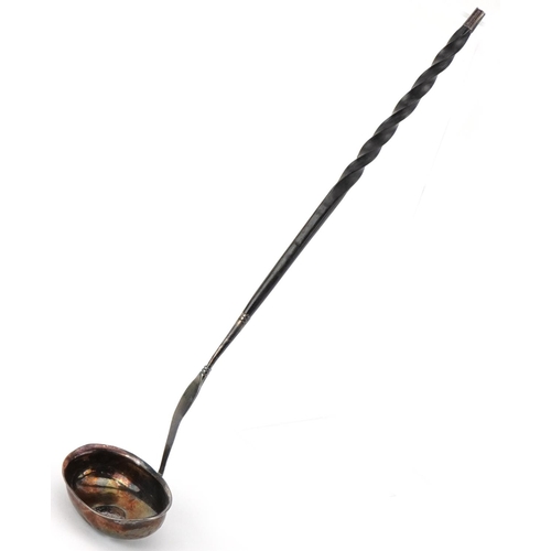 149 - Antique unmarked silver ladle with twisted horn handle set with a Charles II silver coin, 36cm in le... 