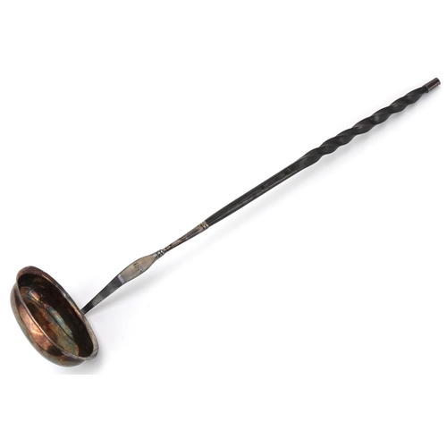 149 - Antique unmarked silver ladle with twisted horn handle set with a Charles II silver coin, 36cm in le... 