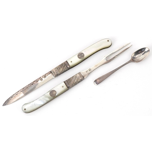 40 - Georgian mother of pearl flanked silver folding fruit knife, fork and spoon set housed in a tooled l... 