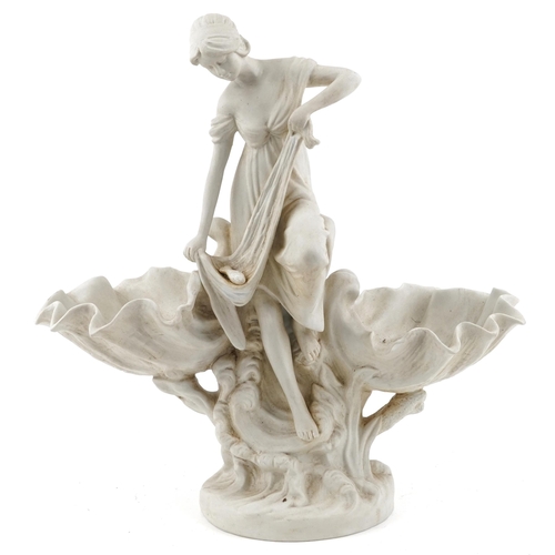 1291 - Large Parian style porcelain centrepiece in the form of a semi clad female catching a fish, 43cm hig... 