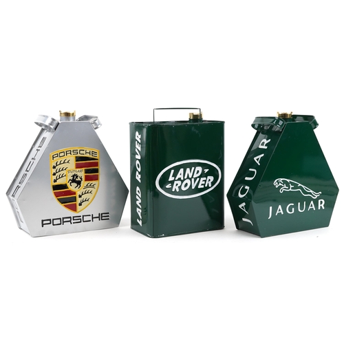 1442 - Three advertising metal fuel cans a Porsche, Jaguar and Land Rover, each 34cm high