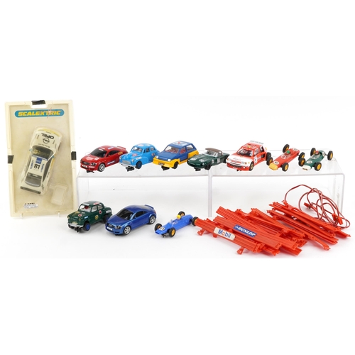 1586 - Eleven vintage and later slot cars and accessories including Scalextric and Hornby