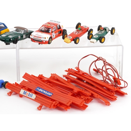 1586 - Eleven vintage and later slot cars and accessories including Scalextric and Hornby